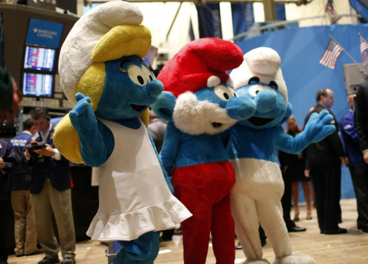 Costumed &quot;Smurfs&quot; characters wave on the main trading floor of the New York Stock Exchange.