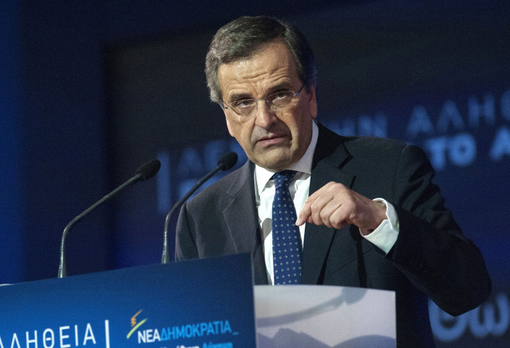 Greek Prime Minister and leader of the conservative New Democracy party Antonis Samaras addresses supporters during an election rally