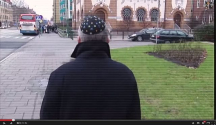Still from the film, showing a reporter being attacked and subjected to antisemitic abuse while taking part in a TV experiment testing attitudes to Jews in malmo, Sweden.