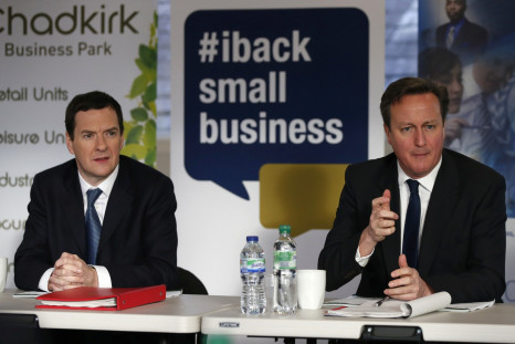 Britain's Prime Minister David Cameron (R) sits with Chancellor George Osborne during a meeting with local small business owners in Stockport, northern England January 9, 2015.