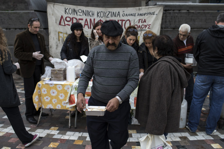 A man receives a portion of food at a soup kitchen, organized during the years of the Greek economic crisis by "The Fellow Man" group, in Athens January 20, 2015.