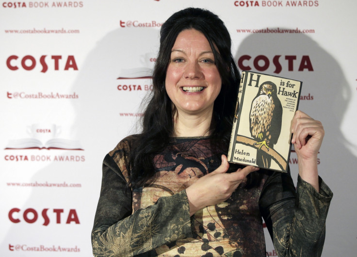 Helen MacDonald, nominee in the 2014 Costa Book Awards and winner of the Costa Biography Award category, poses with her book "H is for hawk"