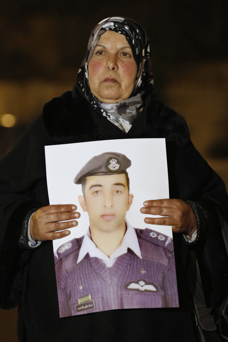 Mother of Islamic State captive Jordanian pilot Muath al-Kasaesbeh holds his picture as she takes part in a demonstration demanding that the Jordanian government negotiate with Islamic state