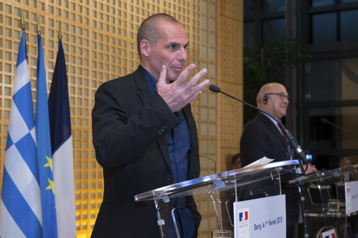 French Finance Minister Michel Sapin (R) and Greek Finance Minister Yanis Varoufakis attend a joint news conference after a meeting at the Bercy Finance Ministry in Paris February 1, 2015.