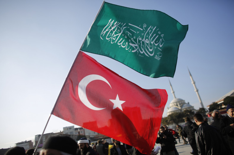 A demonstrator waves Turkish and Islamic flags during a protest against Cumhuriyet, a staunchly secular opposition newspaper, in Istanbul January 15, 2015. Pro-Islamist demonstrators protested against Turkish daily newspaper Cumhuriyet which published a f