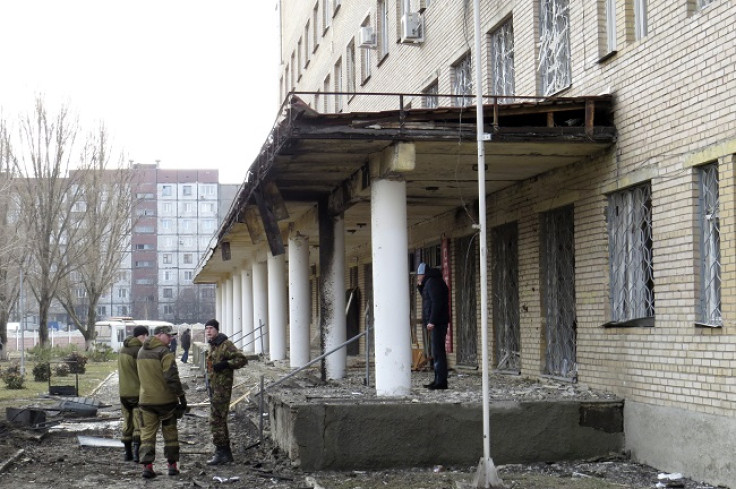 Armed forces of the separatist self-proclaimed Donetsk People's Republic gather outside a hospital