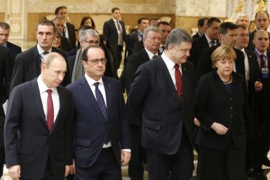 Russia's President Vladimir Putin (L, front), Ukraine's President Petro Poroshenko (2nd R, front), Germany's Chancellor Angela Merkel (R, front) and France's President Francois Hollande (2nd L, front) walk during peace talks in Minsk,