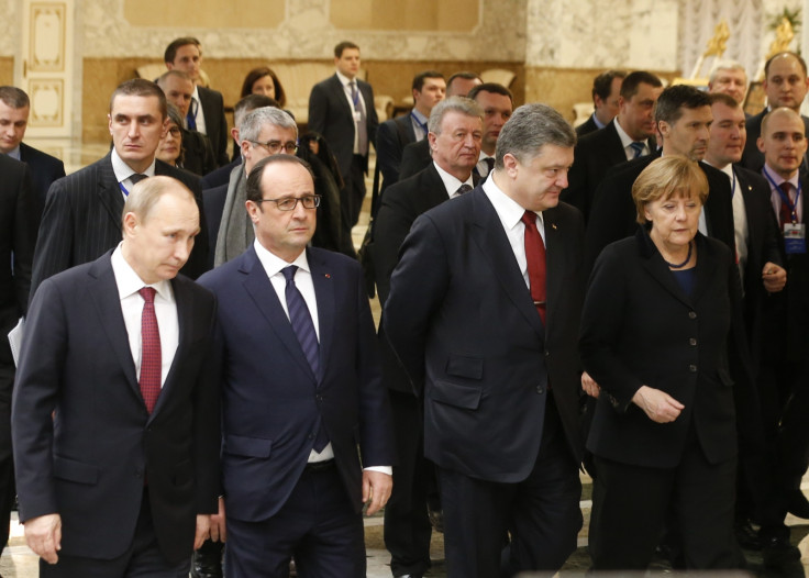 Russia's President Vladimir Putin (L, front), Ukraine's President Petro Poroshenko (2nd R, front), Germany's Chancellor Angela Merkel (R, front) and France's President Francois Hollande (2nd L, front) walk during peace talks in Minsk,