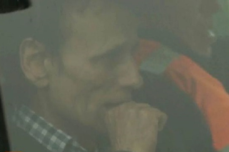 Father Hellmut Ulin after hearing screams of his children allegedly burned to death by their mother Father Hellmut Ulin after hearing screams of his children allegedly burned to death by their mother