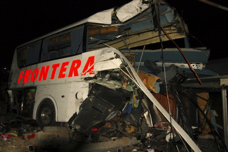 The wreckage of a passenger bus is seen at the site of an accident in Anahuac, Nuevo Leon state