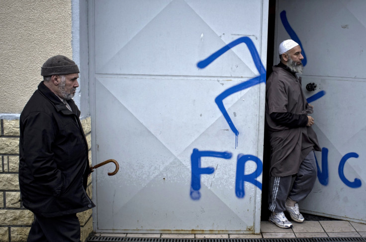 Racist graffiti scrawled on the doors of a Lyon mosque (Getty)