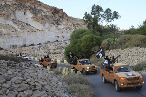 An armed motorcade belonging to members of Derna's Islamic Youth Council, consisting of former members of militias from the town of Derna, drive along a road in Derna, eastern Libya