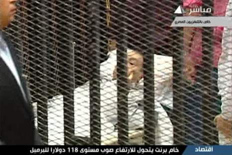 Hosni Mubarak is seen on a hospital bed in the courtroom for his trial at the Police Academy in Cairo in this still image taken from video
