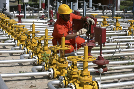 An engineer of Oil and Natural Gas Corp (ONGC) works inside the Kalol oil field in the western Indian state of Gujarat