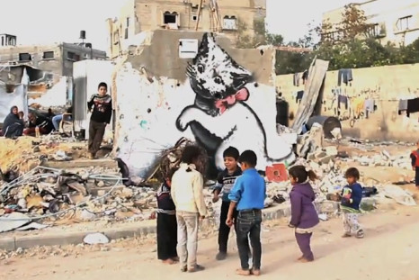 Banksy reveals new work in wry Gaza 'tourism' video