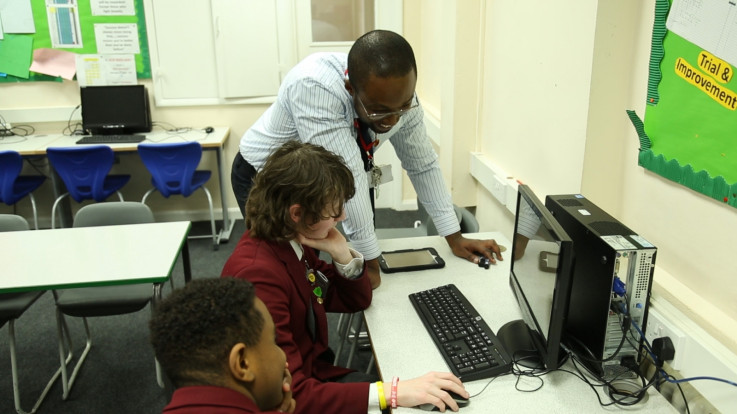 coding teacher with pupils computing UK