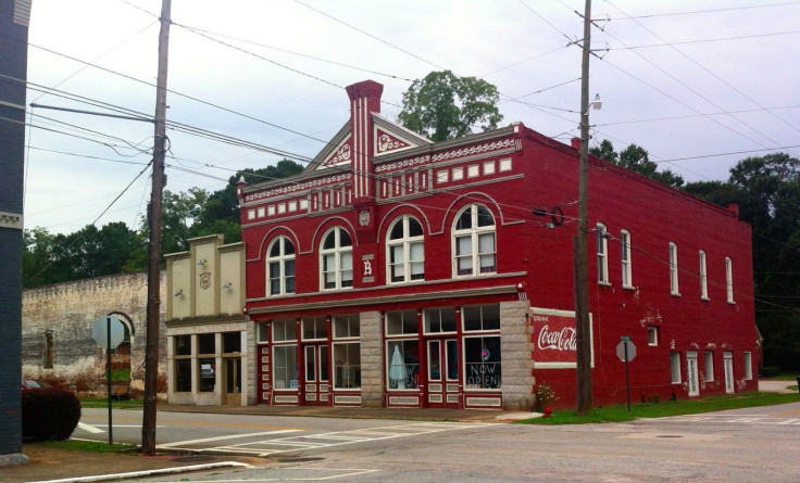 Red building and arched wall