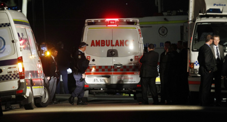 Ambulance arrives outside a house where bomb squad officers were working to protect an 18-year-old girl in Sydney