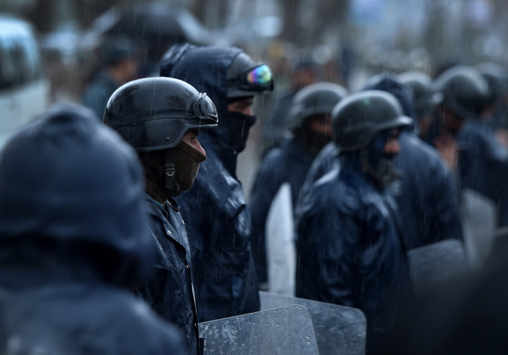 Afghan riot police stand guard