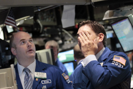 Traders work on the floor of the New York Stock Exchange