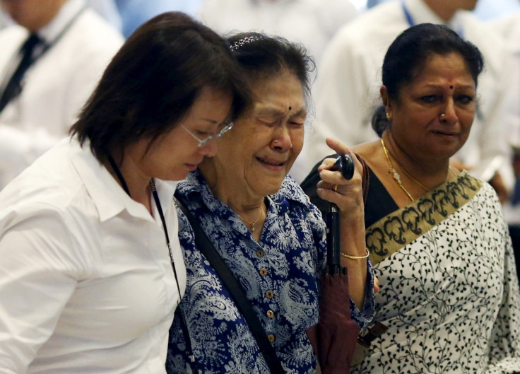 A woman cries Lee Kuan Yew's death