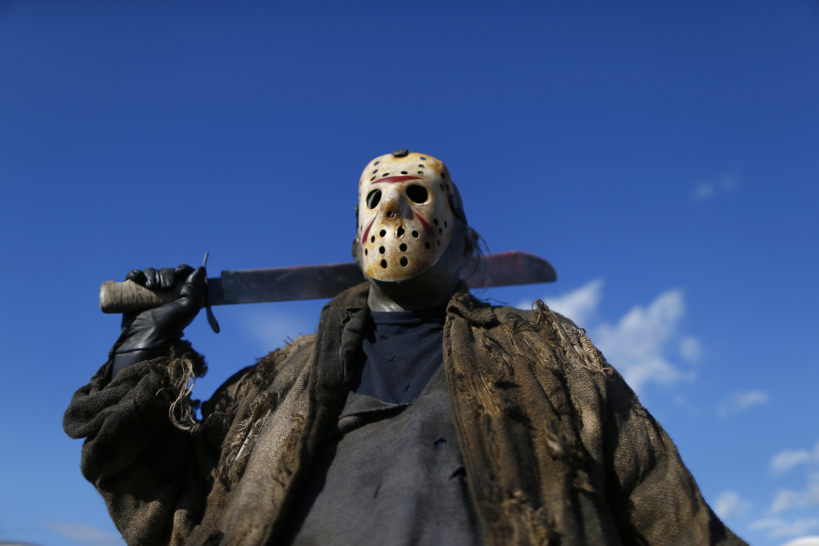 Man attacked with a machete by attacker wearing Friday The 13th 'Jason' hockey mask.