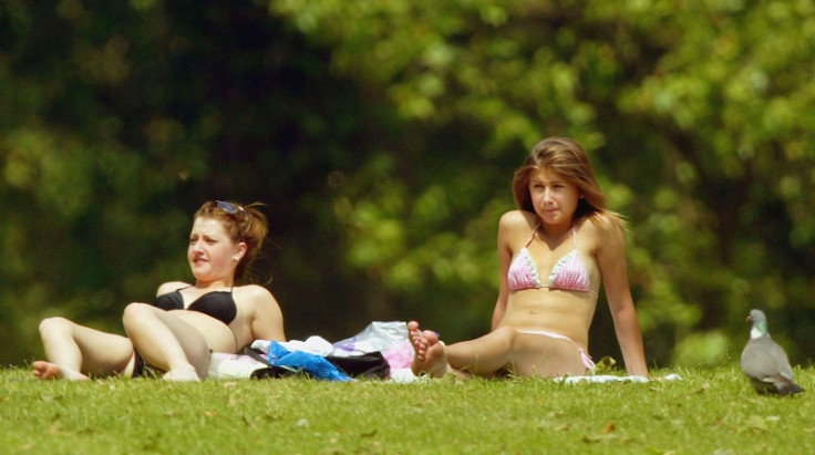 Women sunbathing London park