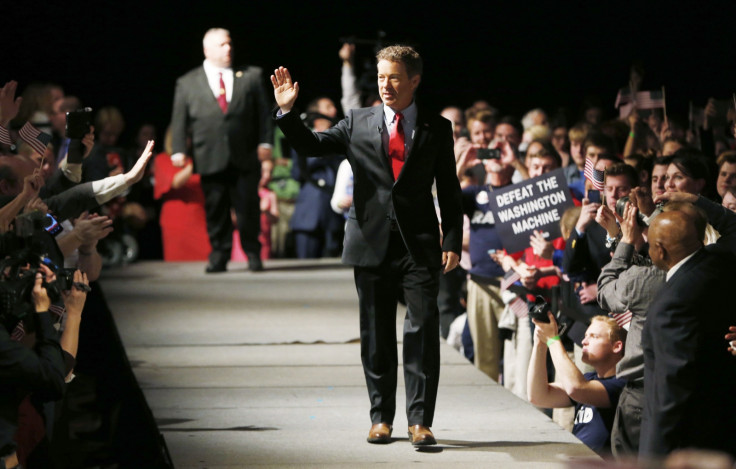 Rand Paul walks on stage in Louisville