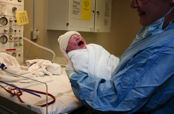 Newborn baby with NHS midwife doctor