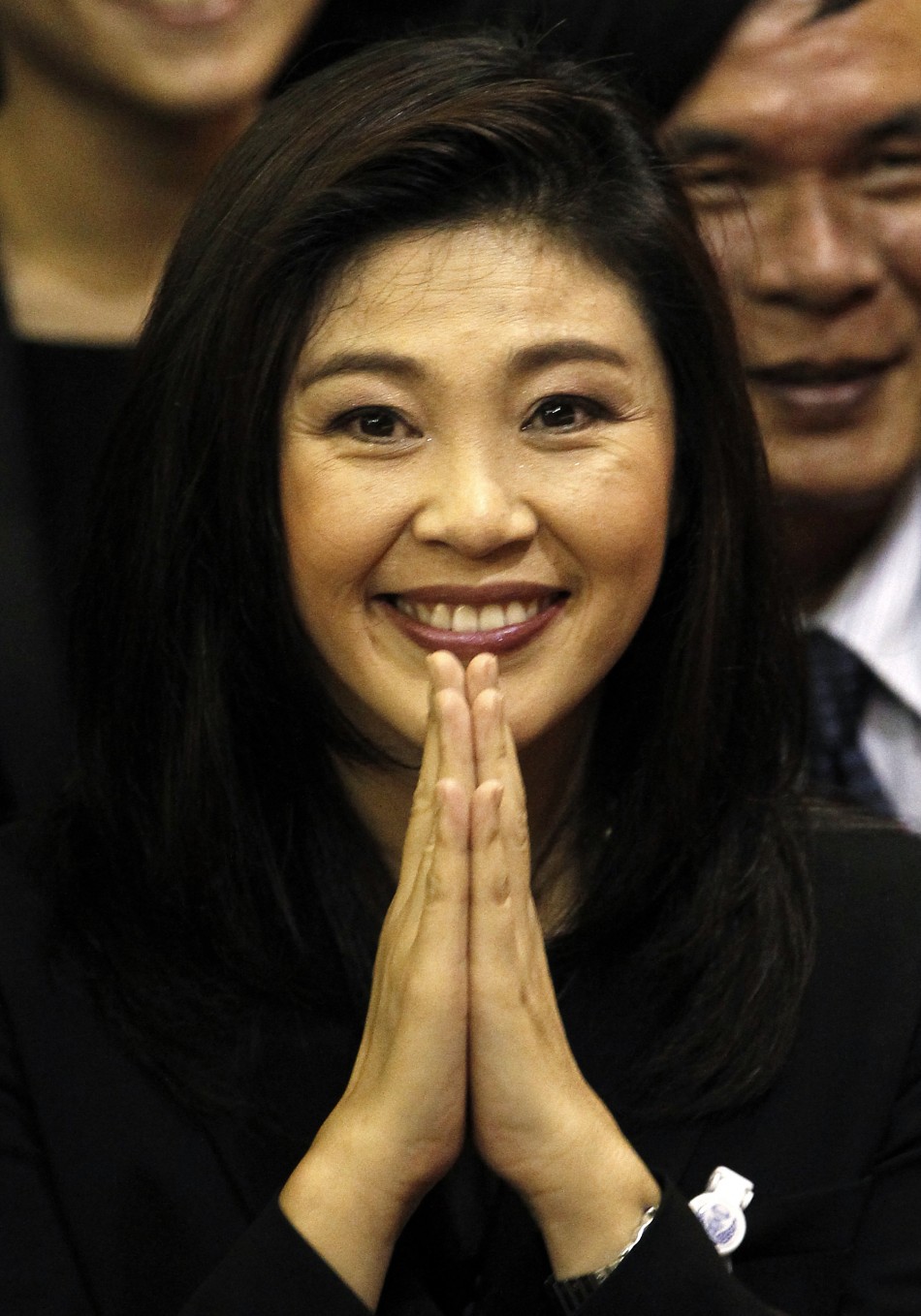 Thailands new PM Shinawatra of the Puea Thai Party gestures to members of parliament moments after being elected as the countrys 28th prime minister in Bangkok