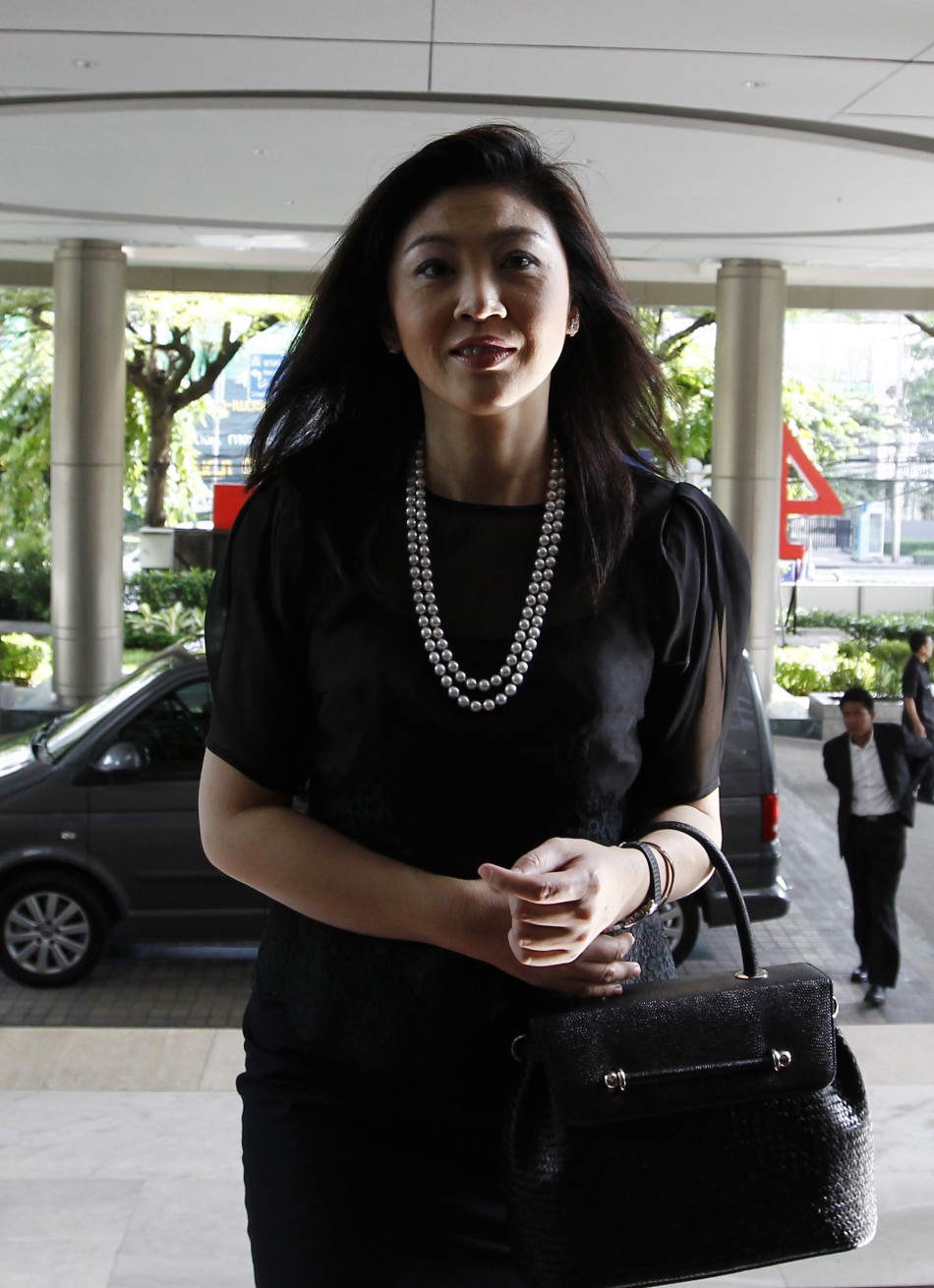 Thailands prime minister elect Yingluck arrives for work at the headquarters of her Puea Thai Party in Bangkok