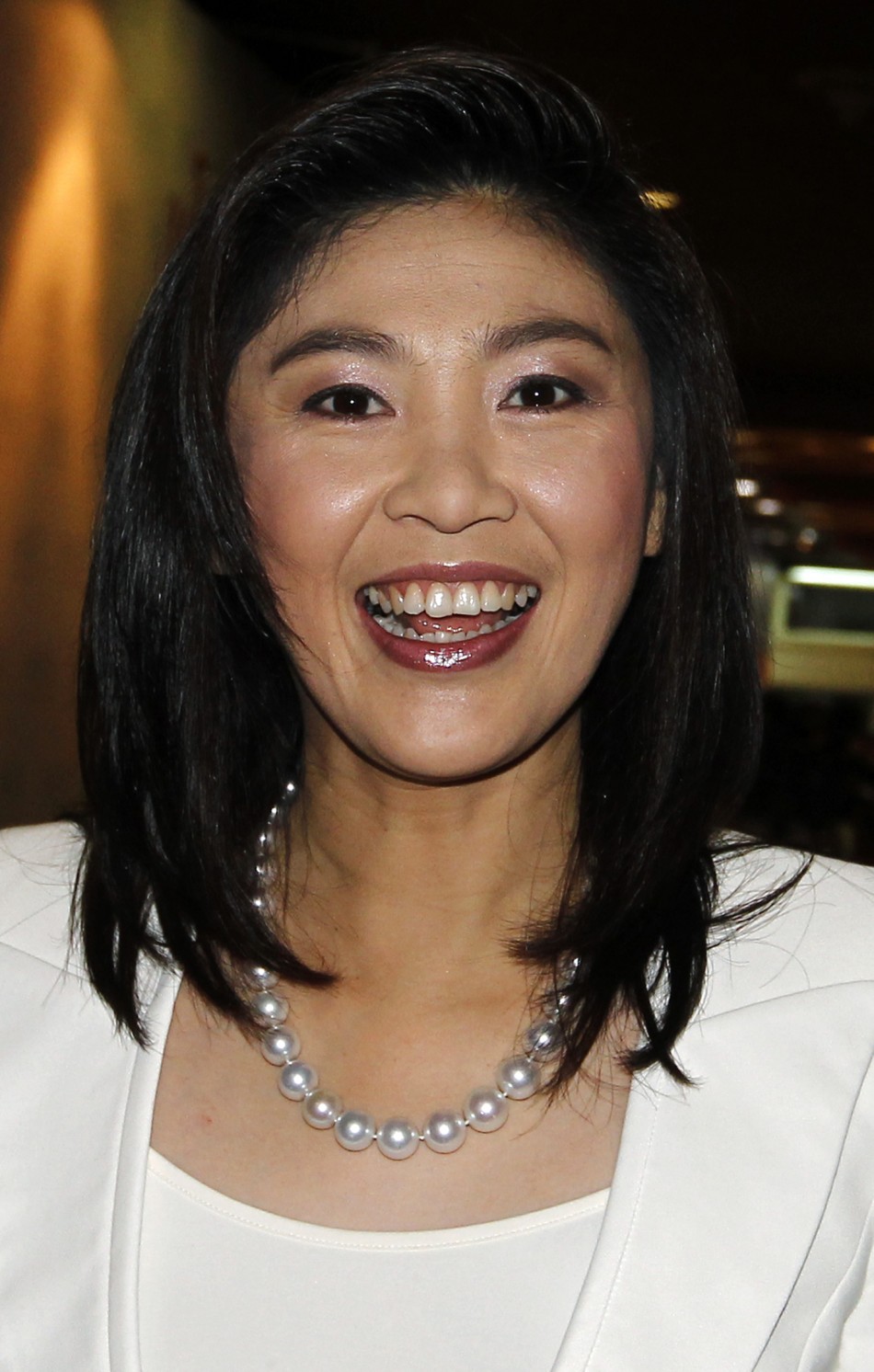 PM-elect Yingluck Shinawatra of the Puea Thai Party arrives at her partys headquarters in Bangkok