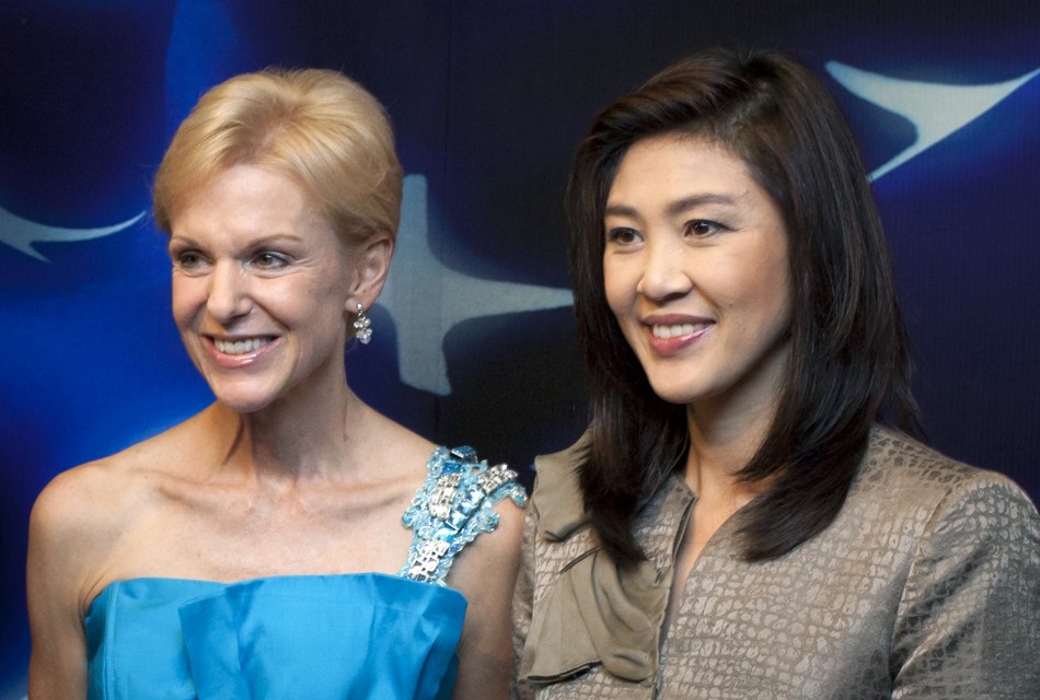 Thailands Prime Minister-elect Yingluck Shinawatra gives United States ambassador Kristie Kenney flowers in Bangkok
