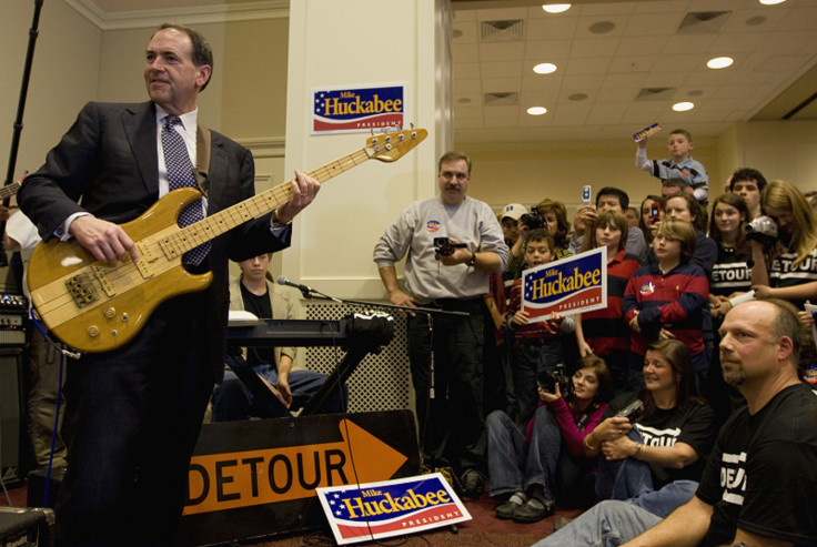 Mike Huckabee plays bass guitar