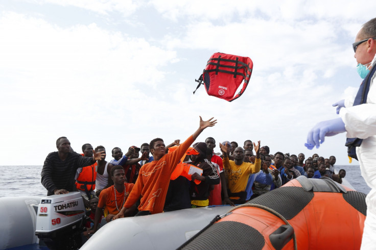 MOAS crew throwing life jackets to migrants