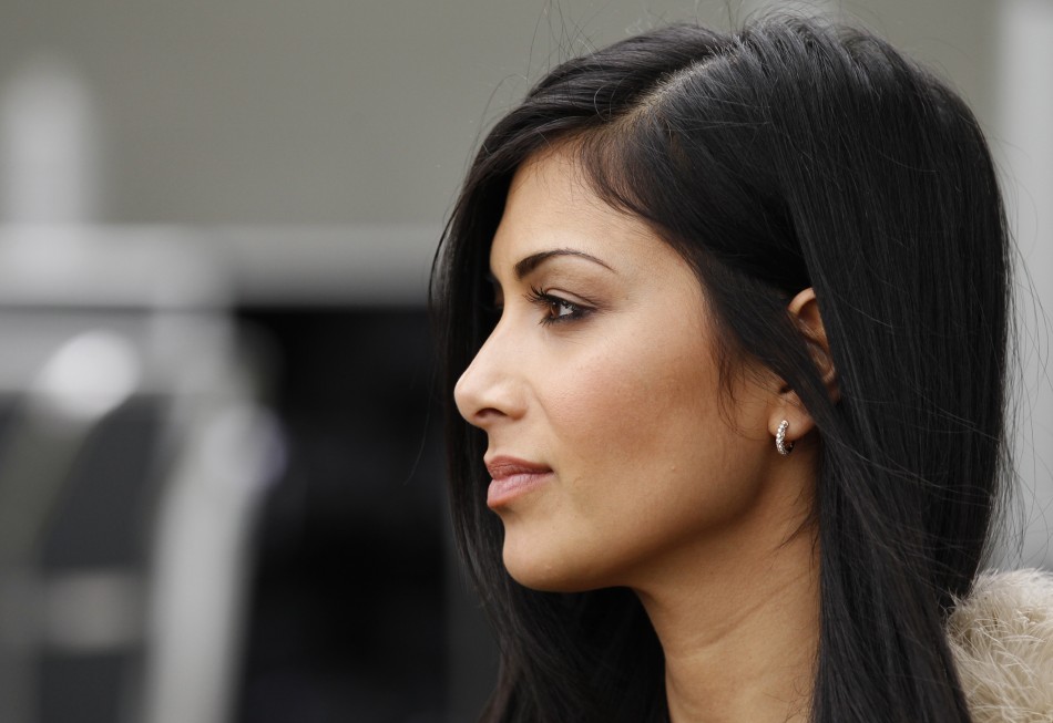 Scherzinger, girlfriend of McLaren Formula One driver Hamilton of Britain, is seen in the pits before the qualifying session of the Australian F1 Grand Prix at the Albert Park circuit in Melbourne