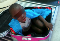 Eight-year-old smuggled in suitcase
