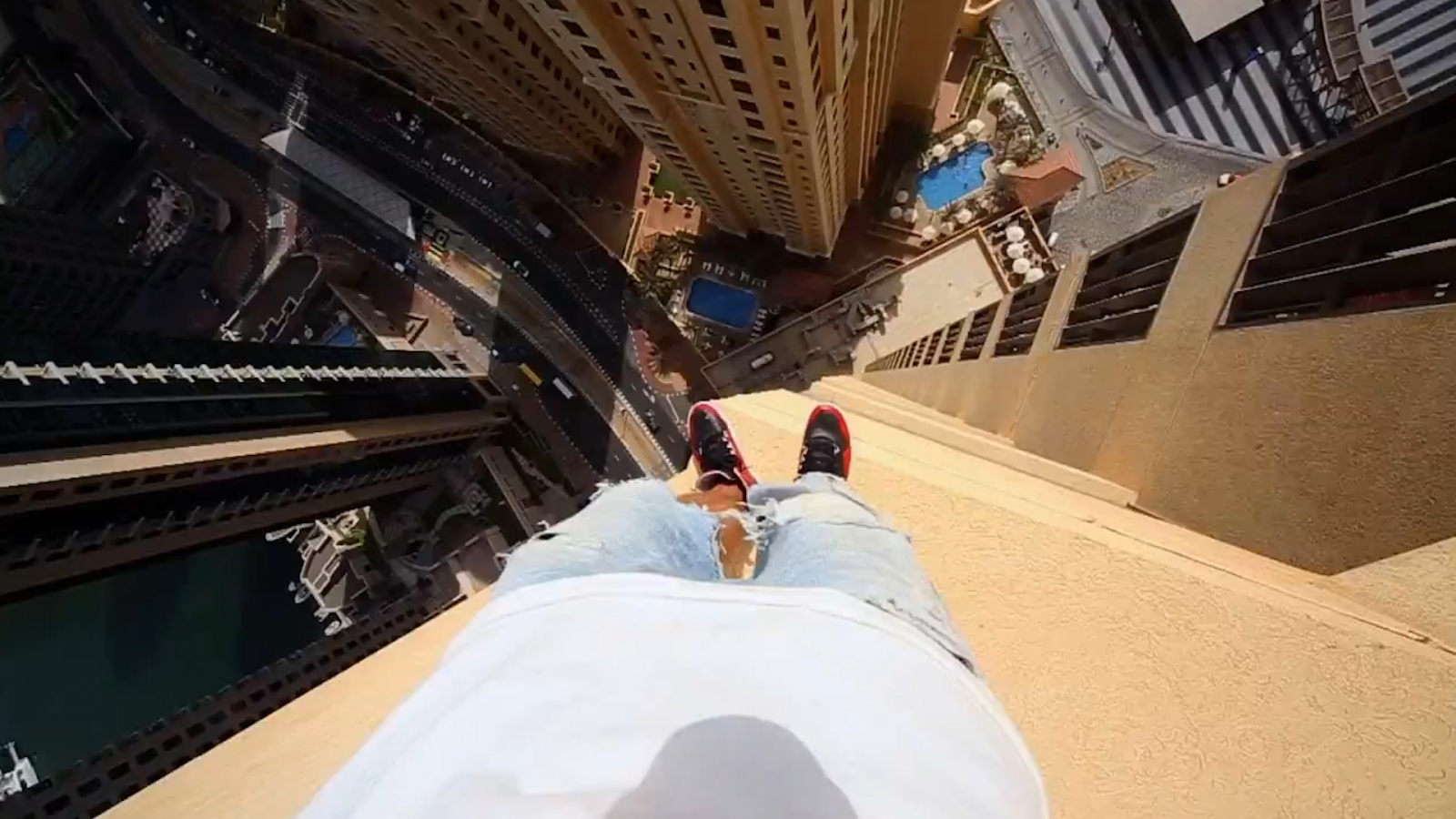 buildings acrophobia Freerunner hotel skyscraper jumps of ledges between Dubai