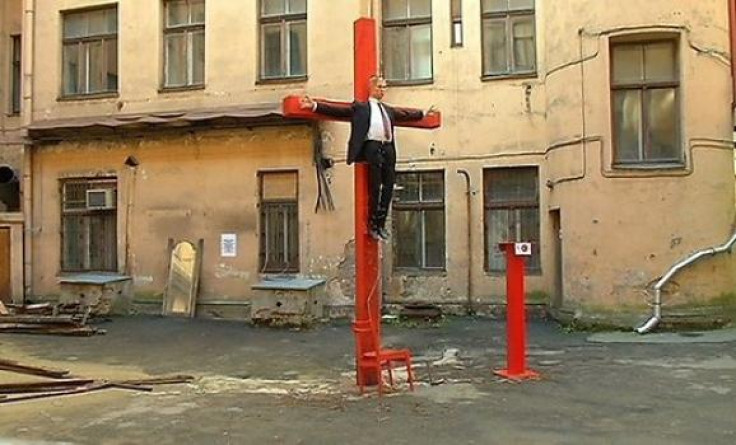 Putin crucified outside the Riga headquarters ofthe