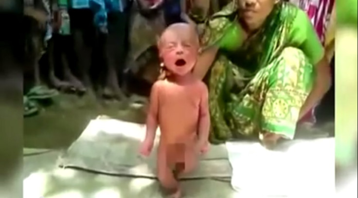 Witch doctor forces Newborn baby to walk