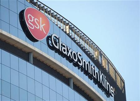 A GlaxoSmithKline logo is seen outside one of its buildings in west London