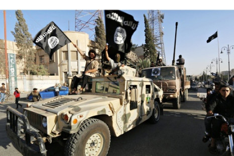 Isis fighters drive a US Humvee