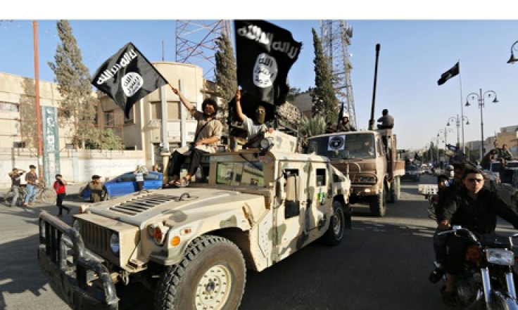 Isis fighters drive a US Humvee