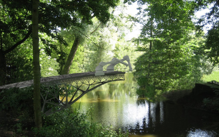 MX3D printing a bridge over a river