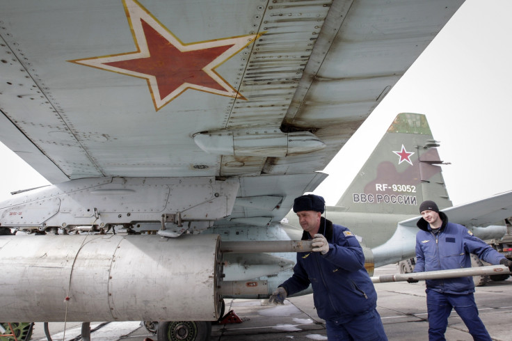 Russian servicemen load air-to-ground missiles
