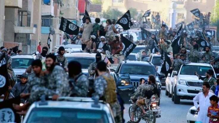 Isis militants parade in Raqqa, Syria