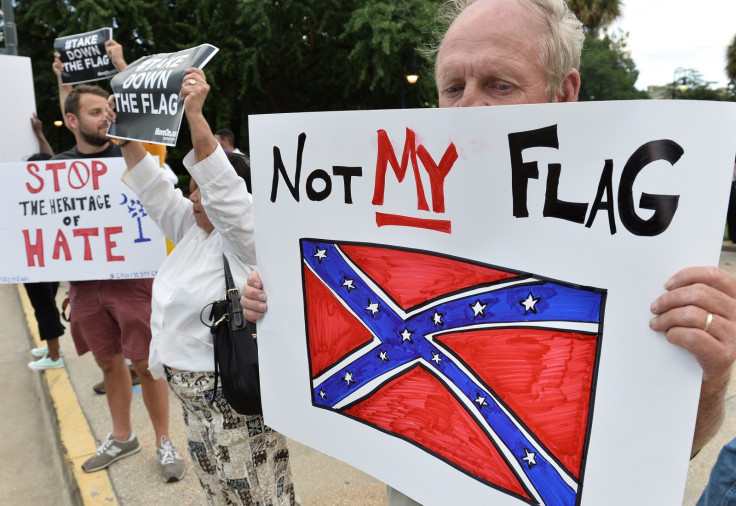 Protesters call for the Confederate floag to