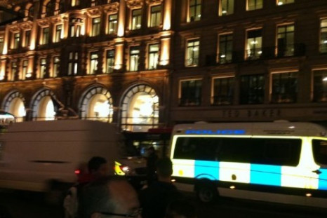 Police Protect Apple Store While Sony Warehouse Burns