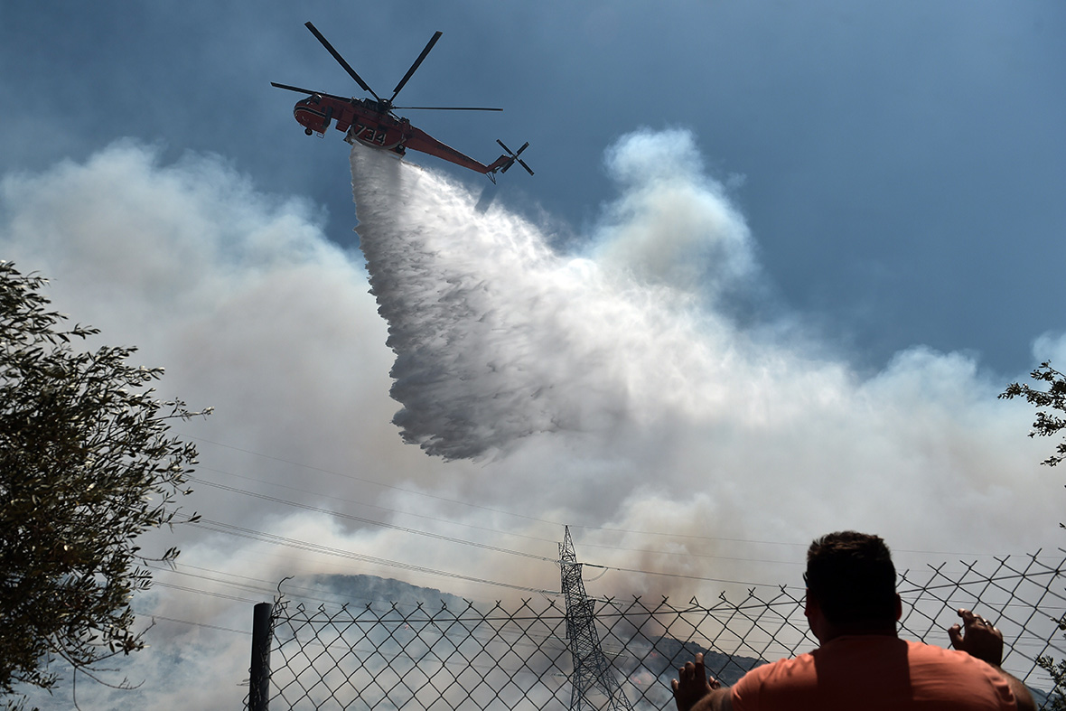 Greece Fire rages on the hills around Athens causing residents to flee