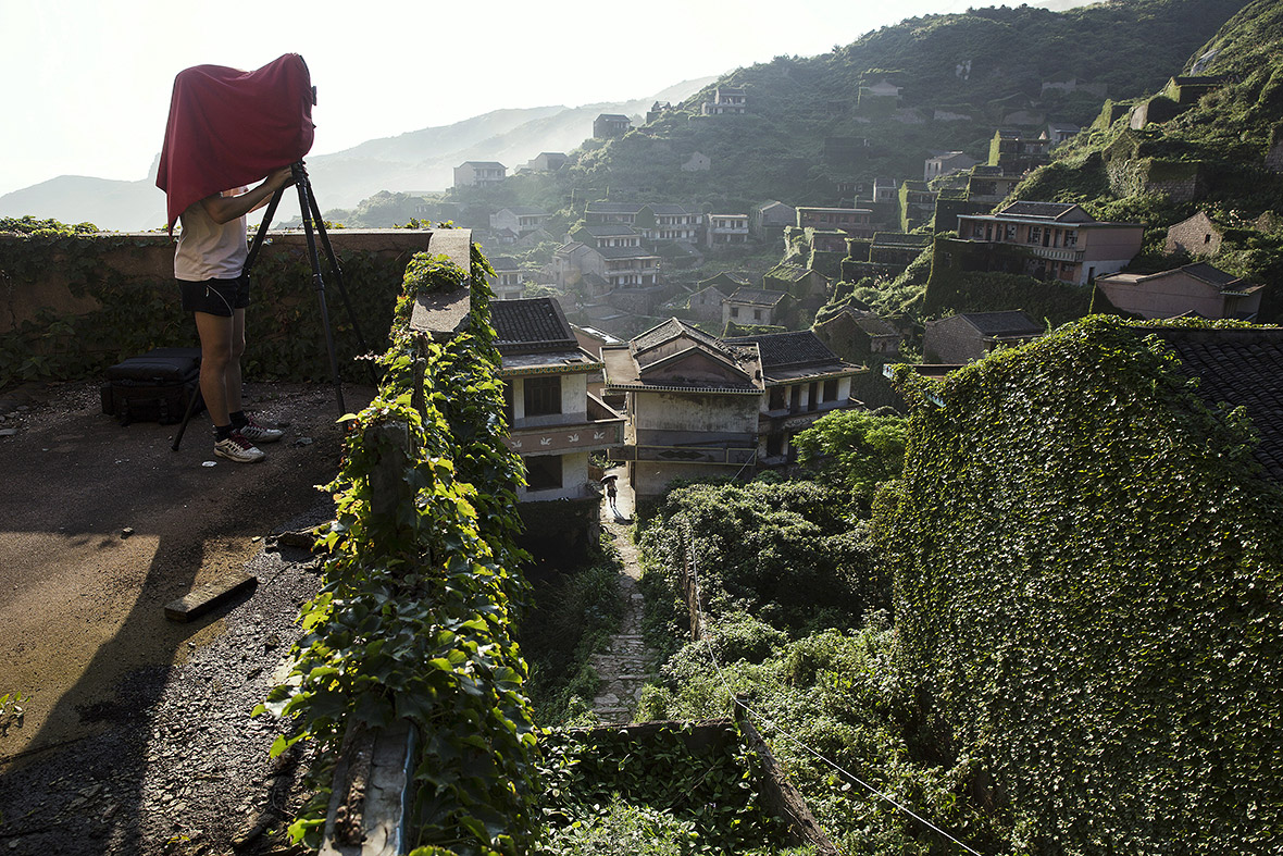 Abandoned village China covered ivy